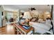 Comfortable living room featuring stylish decor, a ceiling fan, and an open view to the dining area at 3103 77Th E Dr, Sarasota, FL 34243