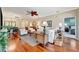 Inviting living room with neutral tones, wood floors, ceiling fan, and comfortable seating arrangement at 3103 77Th E Dr, Sarasota, FL 34243