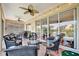 Outdoor patio with seating, string lights, and beautiful backyard views at 3103 77Th E Dr, Sarasota, FL 34243