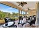 Patio with seating, ceiling fan, and an open view of the lake at 3103 77Th E Dr, Sarasota, FL 34243