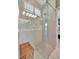 Beautiful glass enclosed walk-in shower features tile and built-in seat at 3103 77Th E Dr, Sarasota, FL 34243