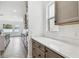 Kitchen with quartz countertops, custom cabinets, stainless steel appliances, and herringbone-patterned floors at 3111 W Nassau St, Tampa, FL 33607