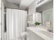 Bright bathroom with white fixtures, shower and vanity at 324 Julia Pl, Sarasota, FL 34236