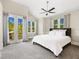 Spacious bedroom with vaulted ceilings, ample natural light, and access to a private balcony at 324 Julia Pl, Sarasota, FL 34236