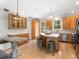 Well-lit kitchen boasts wood cabinets, an island with bar seating, and stainless steel appliances at 324 Julia Pl, Sarasota, FL 34236