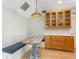 Cozy kitchen nook with wooden table, banquette seating, and built-in cabinets at 324 Julia Pl, Sarasota, FL 34236
