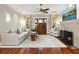 Bright living room featuring a fireplace, hardwood floors, and a large front door at 324 Julia Pl, Sarasota, FL 34236