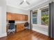 Home office space with built in desk, storage cabinets and bright natural light at 324 Julia Pl, Sarasota, FL 34236
