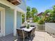 Covered outdoor patio features a dining table with seating, perfect for alfresco meals and entertaining guests at 324 Julia Pl, Sarasota, FL 34236