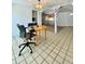 Open-concept dining area featuring tile floors, chandelier, and view into the living area at 3325 Honeymoon Ln, Holiday, FL 34691