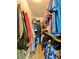 Walk-in closet with hanging clothes and shelving at 3325 Honeymoon Ln, Holiday, FL 34691