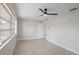 Bedroom with tile floor, ceiling fan and natural light at 3370 Harbor Lake Dr, Largo, FL 33770