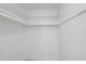 Walk in closet with built in storage shelving at 3370 Harbor Lake Dr, Largo, FL 33770
