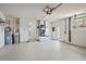 Spacious and clean garage with white walls and floors, offering ample storage and functionality at 3370 Harbor Lake Dr, Largo, FL 33770