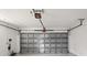 Durable garage door with opener and track hardware in a spacious, clean garage setting at 3370 Harbor Lake Dr, Largo, FL 33770