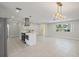 Open concept living room and kitchen area with modern appliances, tile flooring, and recessed lighting at 3370 Harbor Lake Dr, Largo, FL 33770