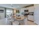 Modern kitchen with granite countertops, stainless steel appliances, and a breakfast bar with seating at 4308 112Th E St, Palmetto, FL 34221