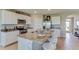 Modern kitchen with granite countertops, stainless steel appliances, and an island with bar seating at 4312 112Th E St, Palmetto, FL 34221