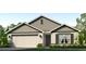 Charming one-story home featuring a two-car garage, well-manicured lawn, and inviting front entrance at 4319 112Th E St, Palmetto, FL 34221