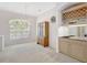 Dining area features a built-in wet bar, a large window that provides natural light, and ample room for entertaining at 4730 Old Farm Rd, Sarasota, FL 34233