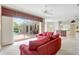 Open-concept living room with views of the pool area and connected to a stylish kitchen at 4730 Old Farm Rd, Sarasota, FL 34233