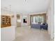 Open-concept living space featuring tile floors and sliding glass doors to the outdoor area at 4730 Old Farm Rd, Sarasota, FL 34233