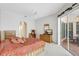 Spacious main bedroom featuring an ensuite bathroom and access to the screened-in lanai at 4730 Old Farm Rd, Sarasota, FL 34233