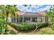 Gorgeous pool with screened-in lanai and lush landscaping creates a private backyard oasis at 4730 Old Farm Rd, Sarasota, FL 34233