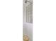 Close-up of a modern shower with glass block details and a chrome showerhead at 4730 Old Farm Rd, Sarasota, FL 34233