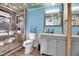 Bright bathroom featuring a glass-enclosed shower and stylish vanity at 4918 Lahaina Dr, Sarasota, FL 34232