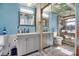 Dual vanity bathroom with large mirrors and modern fixtures at 4918 Lahaina Dr, Sarasota, FL 34232
