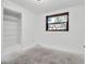 An empty room with a window and closet at 4918 Lahaina Dr, Sarasota, FL 34232