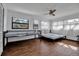 A sun-filled bedroom with hardwood floors and multiple windows at 4918 Lahaina Dr, Sarasota, FL 34232