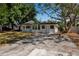 Charming single-story home featuring a classic white facade and a spacious driveway at 4918 Lahaina Dr, Sarasota, FL 34232
