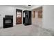 Kitchen with stainless-steel fridge and oven, also featuring a rustic door and covered window at 4918 Lahaina Dr, Sarasota, FL 34232