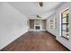 Open-concept living room featuring a brick fireplace and hardwood floors at 4918 Lahaina Dr, Sarasota, FL 34232