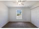 Bright bedroom features neutral carpet, closet and a window with blinds at 5526 River Sound Ter, Bradenton, FL 34208