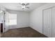 Neutral bedroom with ceiling fan, carpet, and ensuite access at 5526 River Sound Ter, Bradenton, FL 34208
