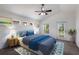 Stylishly furnished bedroom with vaulted ceiling, balcony access, and plenty of natural light at 5526 River Sound Ter, Bradenton, FL 34208