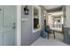 Inviting front porch with seating, a decorative lantern, and a view of the neighborhood at 5526 River Sound Ter, Bradenton, FL 34208