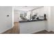Modern kitchen with stainless steel appliances, granite countertops, and breakfast bar at 5526 River Sound Ter, Bradenton, FL 34208