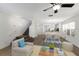 Bright living room featuring hardwood floors, dining area, and staircase to the second floor at 5526 River Sound Ter, Bradenton, FL 34208