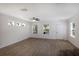 Bright, open living room with multiple windows, hardwood floors, and ceiling fan at 5526 River Sound Ter, Bradenton, FL 34208