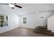 Welcoming living area with wood-look floors and stairs leading to the upper level at 5526 River Sound Ter, Bradenton, FL 34208