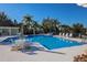 Resort-style pool featuring ample seating, lush landscaping, and sparkling water at 5526 River Sound Ter, Bradenton, FL 34208