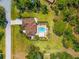 Aerial view of a home with a private pool and lush landscaping at 5603 Ravenwood Dr, Sarasota, FL 34243