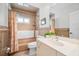 Bathroom features a shower-tub combo, neutral tiling and plenty of natural light at 5603 Ravenwood Dr, Sarasota, FL 34243