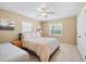 Bedroom featuring a queen bed, a daybed, and neutral decor with natural light from the window at 5603 Ravenwood Dr, Sarasota, FL 34243
