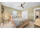 Bedroom with a ceiling fan, neutral paint and tile flooring at 5603 Ravenwood Dr, Sarasota, FL 34243