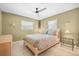 Bedroom with a ceiling fan, neutral paint and tile flooring at 5603 Ravenwood Dr, Sarasota, FL 34243